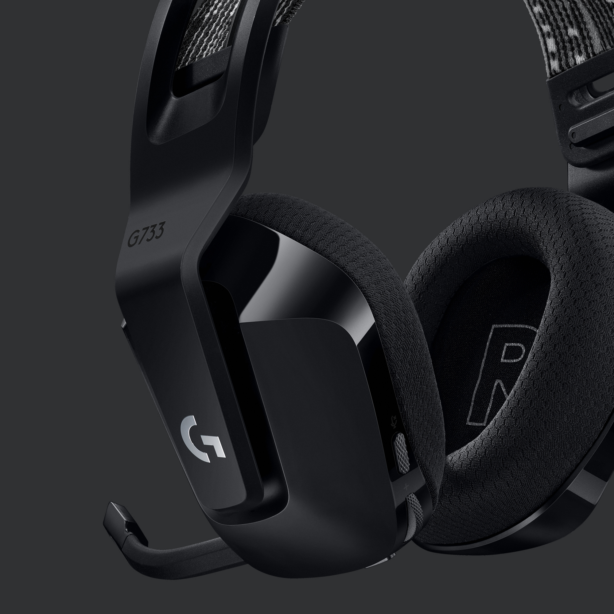 Black gaming headset with a microphone. The earcups are black with the letter 'G' and 'R'.