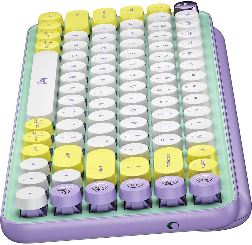 Un clavier coloré avec des touches rondes en jaune, blanc et violet, sur une base vert clair.