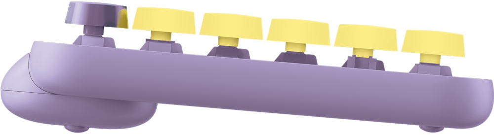 Clavier violet avec touches jaunes. Vue latérale, isolé sur fond blanc.