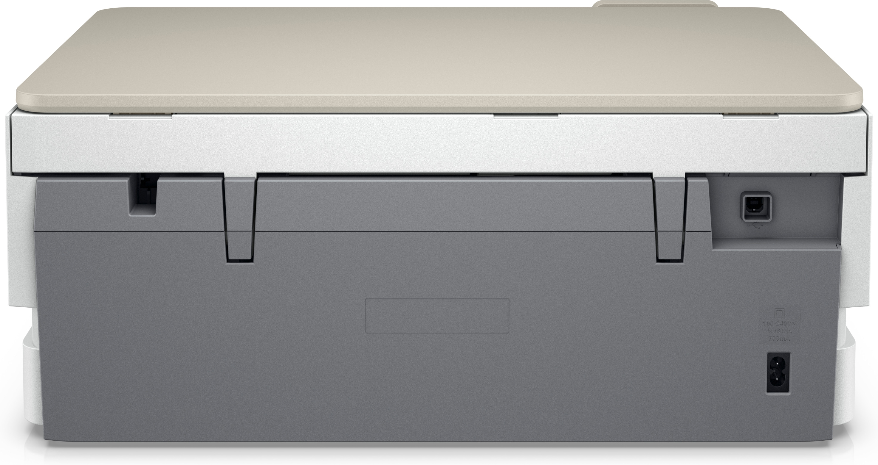 Arrière d'une imprimante. Une imprimante blanche et beige, avec une base grise.