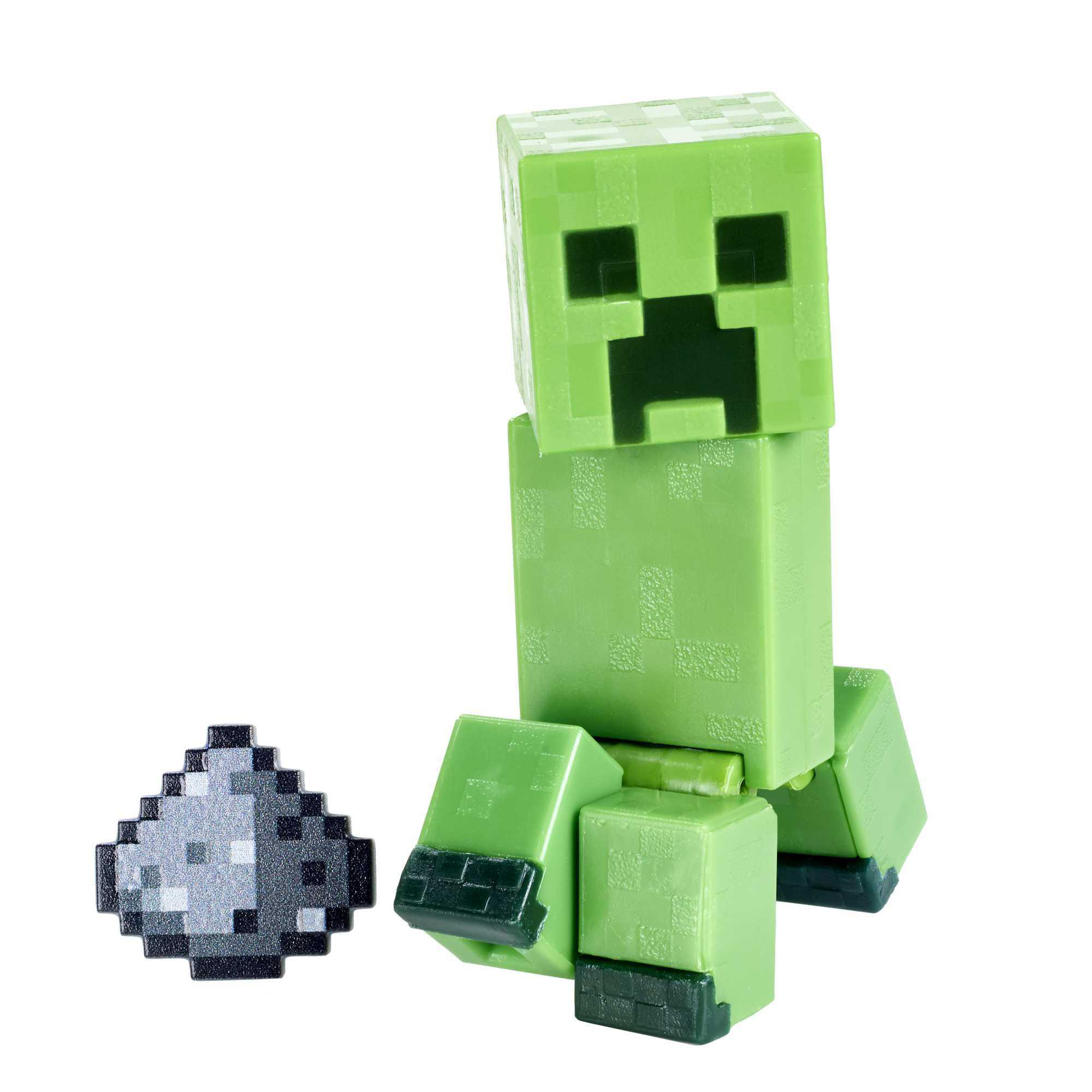 Ein grünes Minecraft Creeper-Spielzeug mit einem Gegenstand daneben.