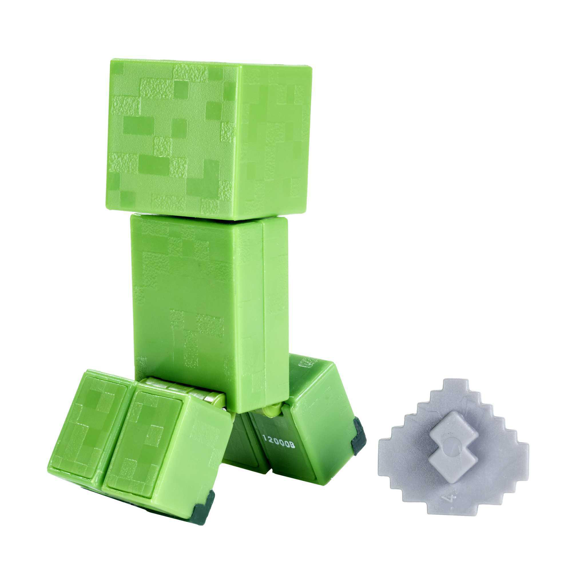 Grüne Minecraft Creeper-Figur. Es hat einen blockartigen Kopf, Körper und Beine. Ein grauer Block liegt daneben.