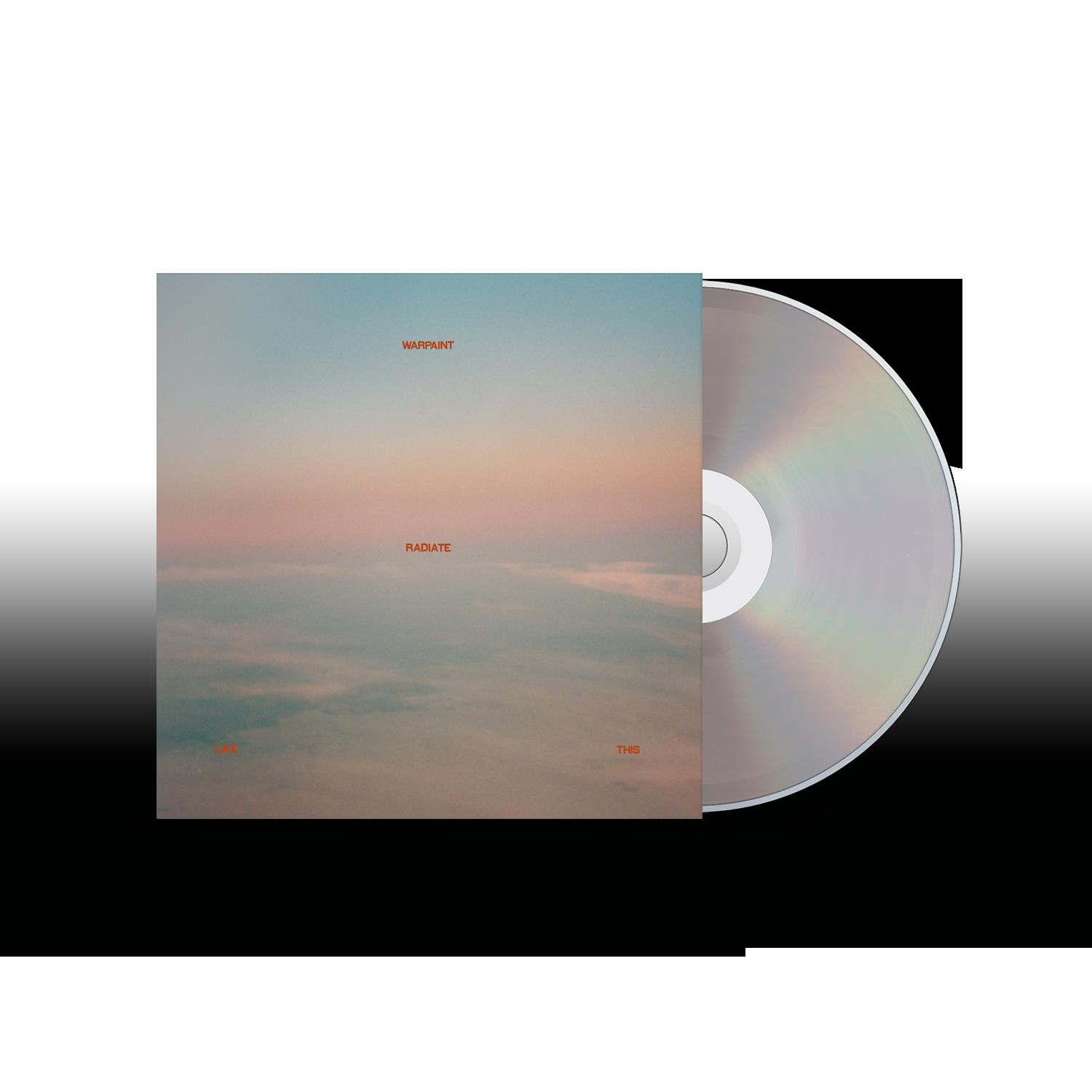 CD-Cover des Warpaint-Albums 'Radiate Like This' mit Himmelsbild und CD auf Schwarz.