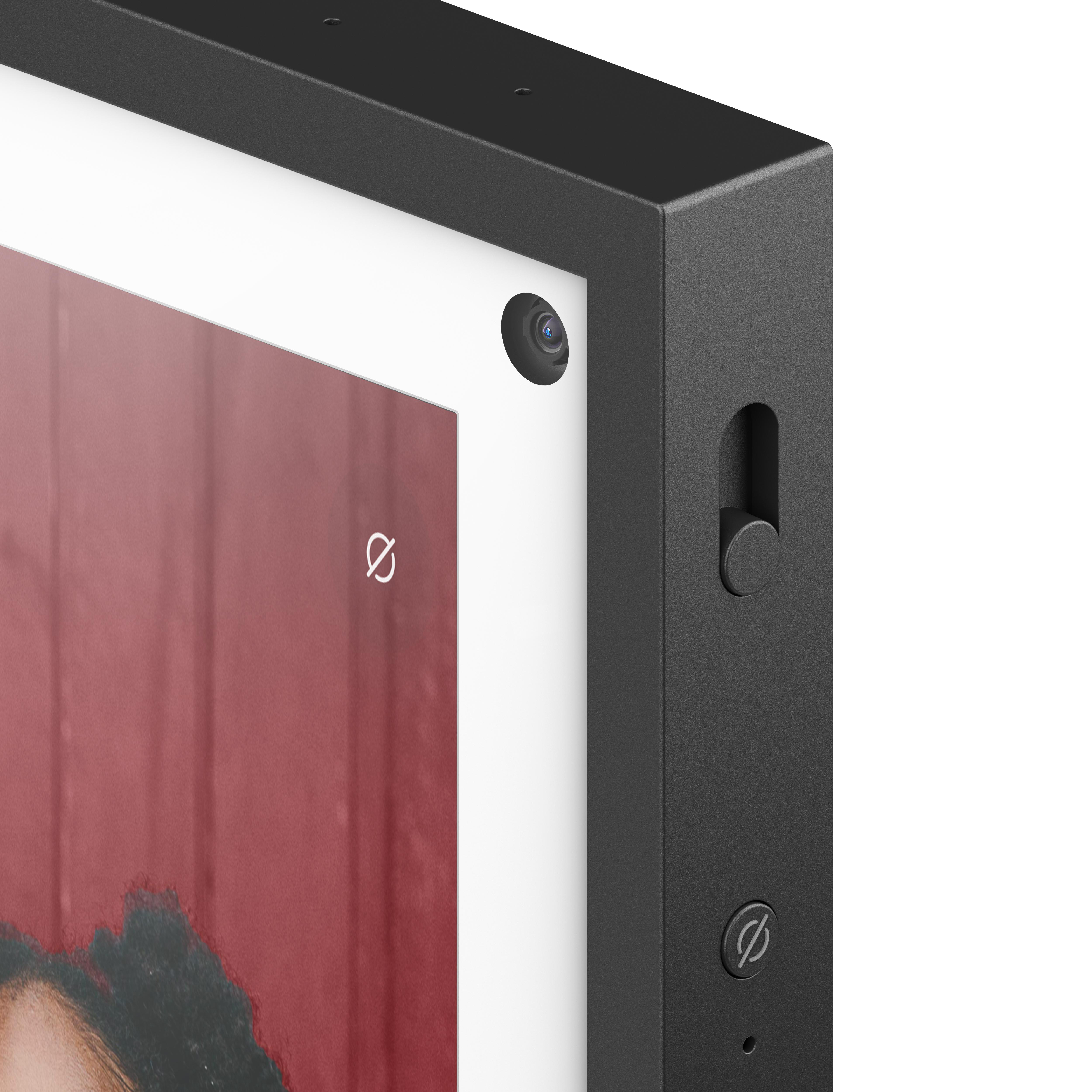 Nahaufnahme der Ecke eines schwarzen Smart-Displays, mit Kamera und Bedienelementen.