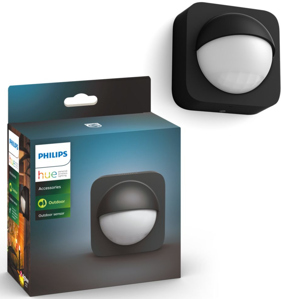 Capteur extérieur noir Philips Hue et boîte. La boîte montre le capteur et une image de forêt.