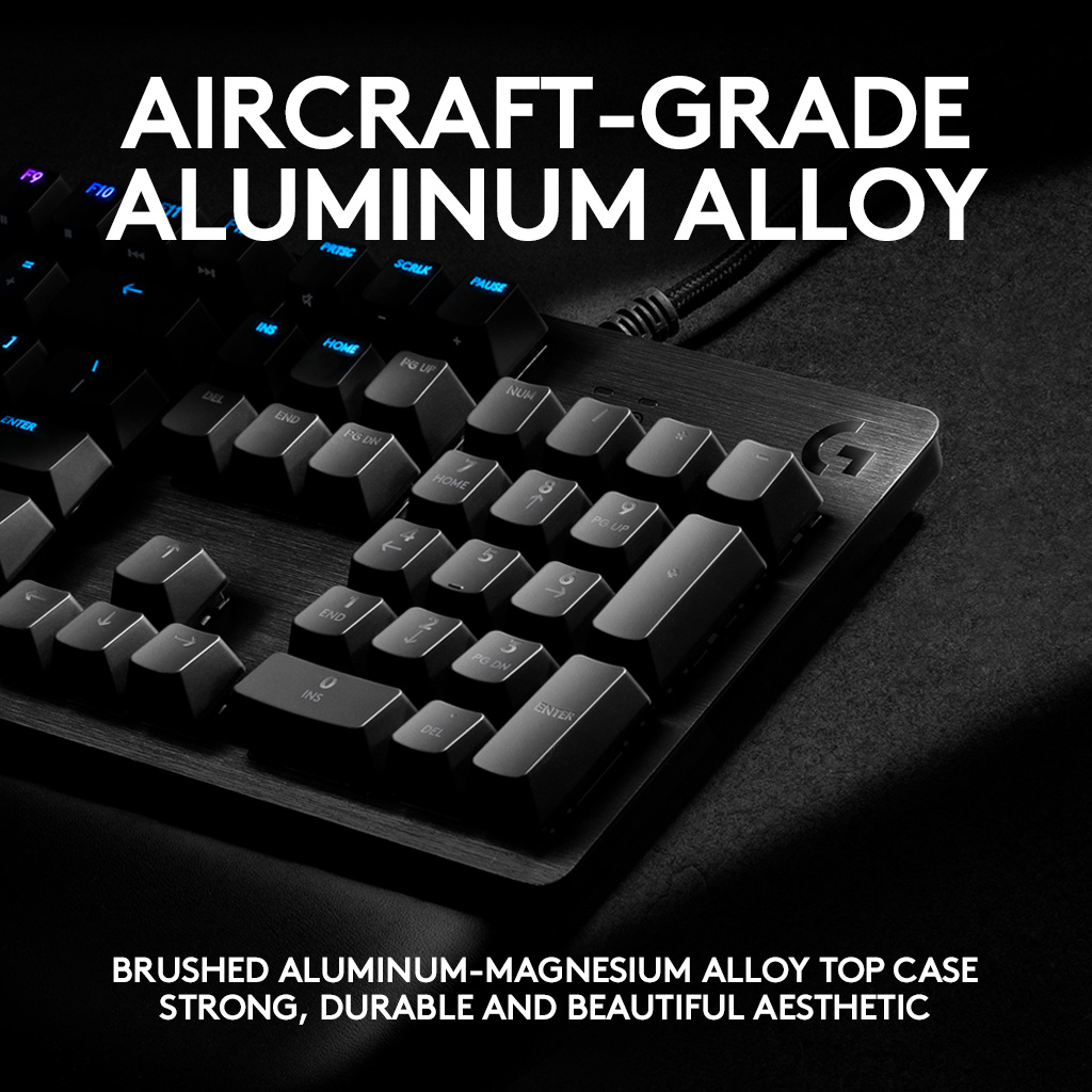 Clavier noir avec lettrage blanc. Le texte indique 'Aircraft Grade Aluminum Alloy'.