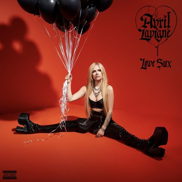 Avril Lavigne lufikat tart és pózol piros háttér előtt, album borítóval és szöveggel.