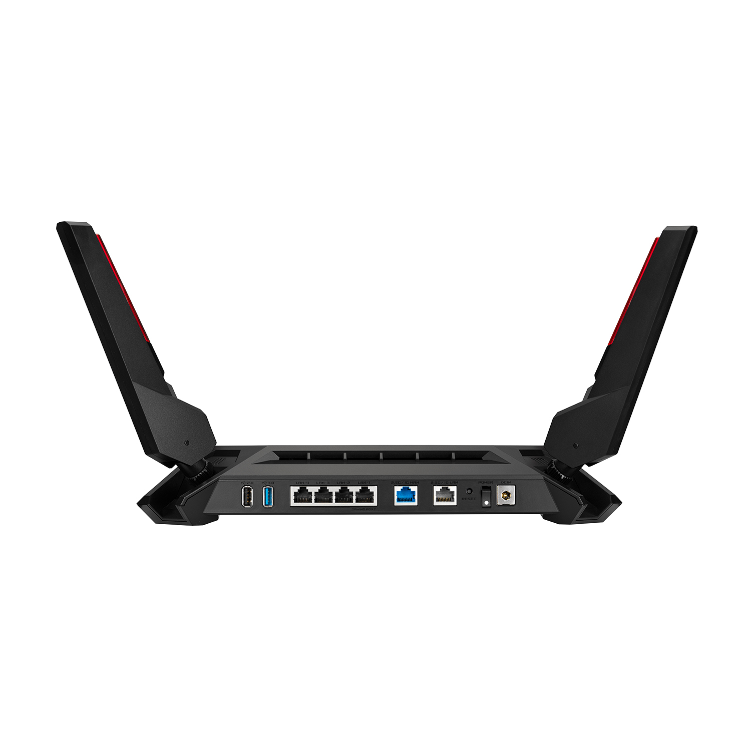 Un router nero con antenne, porte e un ingresso di alimentazione su una superficie bianca.
