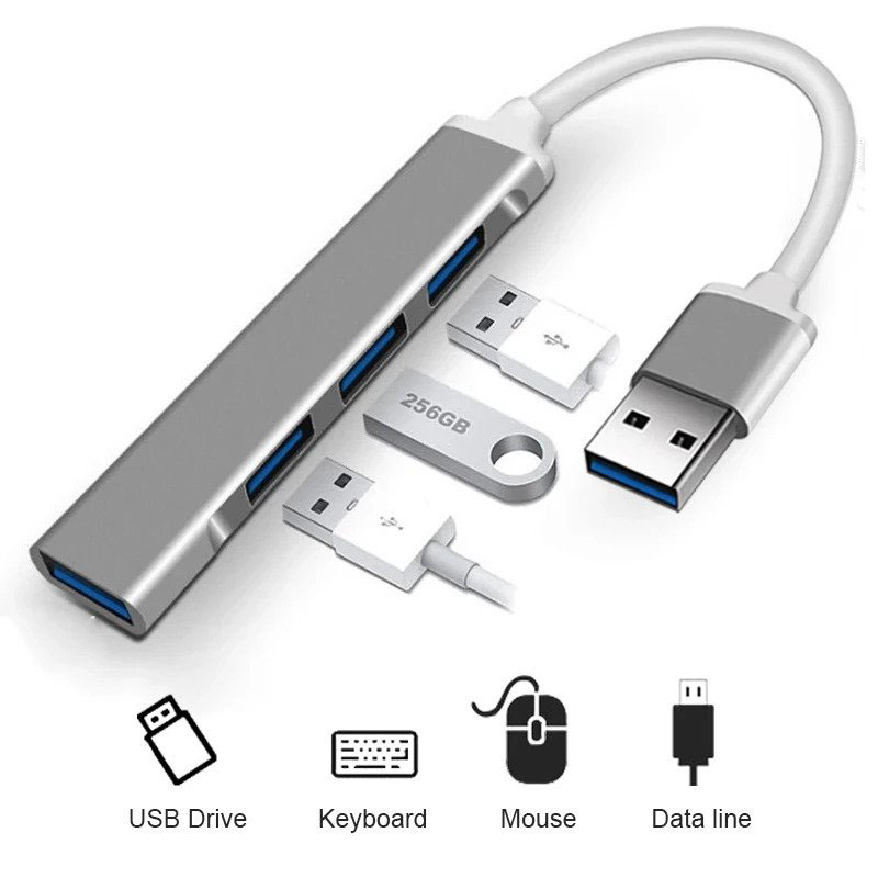 USB hub, altında fare ve klavye sembolleri bulunan çeşitli USB sürücüleri ve bağlantı noktalarıyla.