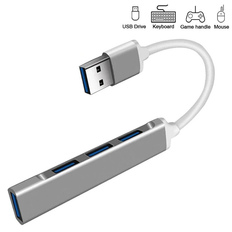 Dört USB portlu ve beyaz kablolu gümüş bir USB hub.