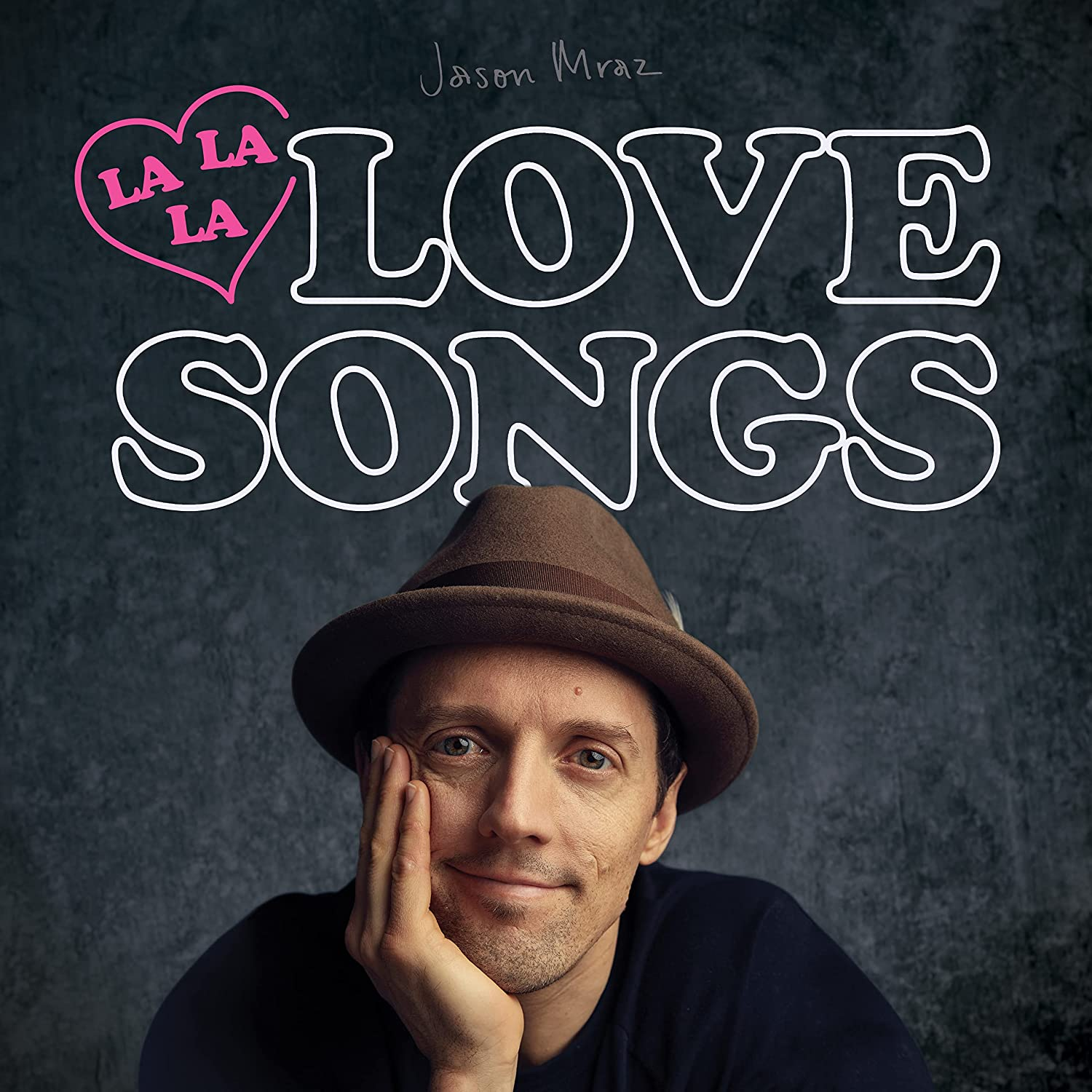 Album borító egy férfi arccal, a 'LOVE SONGS' címmel és egy szívvel.