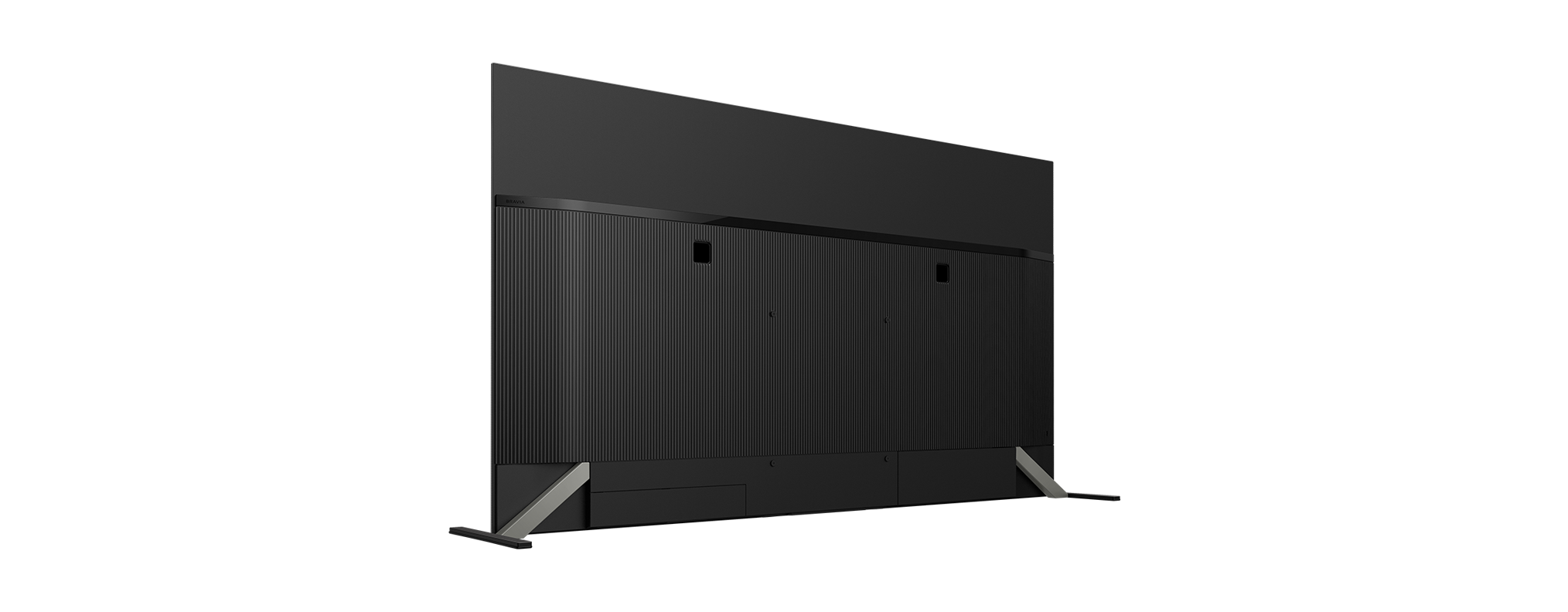 Schwarzer Fernseher von hinten. Er hat eine strukturierte Rückseite, ein flaches schwarzes Oberteil und silberne Beine.