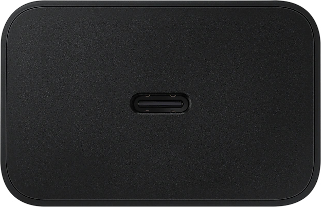 Black, rectangular charging adapter with a USB-C port. Plain, minimalist design.
