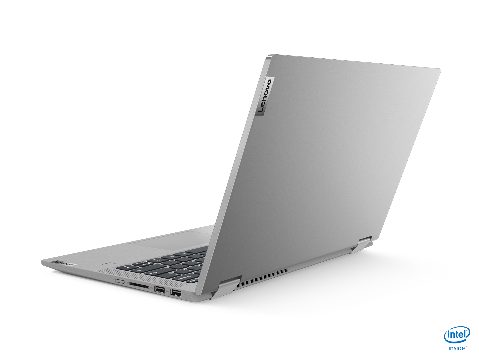 Siyah bir arka plan üzerinde kapalı gümüş dizüstü bilgisayar, Intel Inside logosu görünüyor.