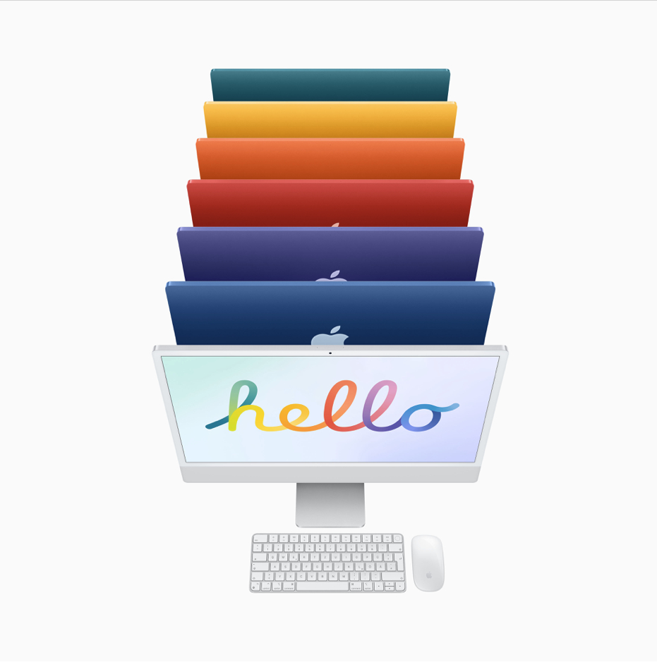 Ein iMac mit farbigen Rückseiten und passender Tastatur und Maus.