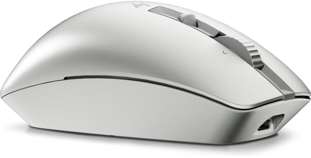Une souris blanche avec une molette et un port de charge, sur fond blanc.