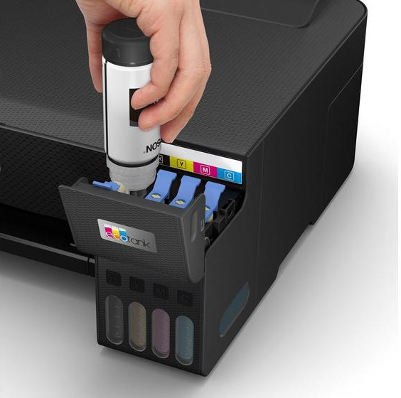 Hand inserting ink into an Epson printer. Ink bottle is white and printer is black.
