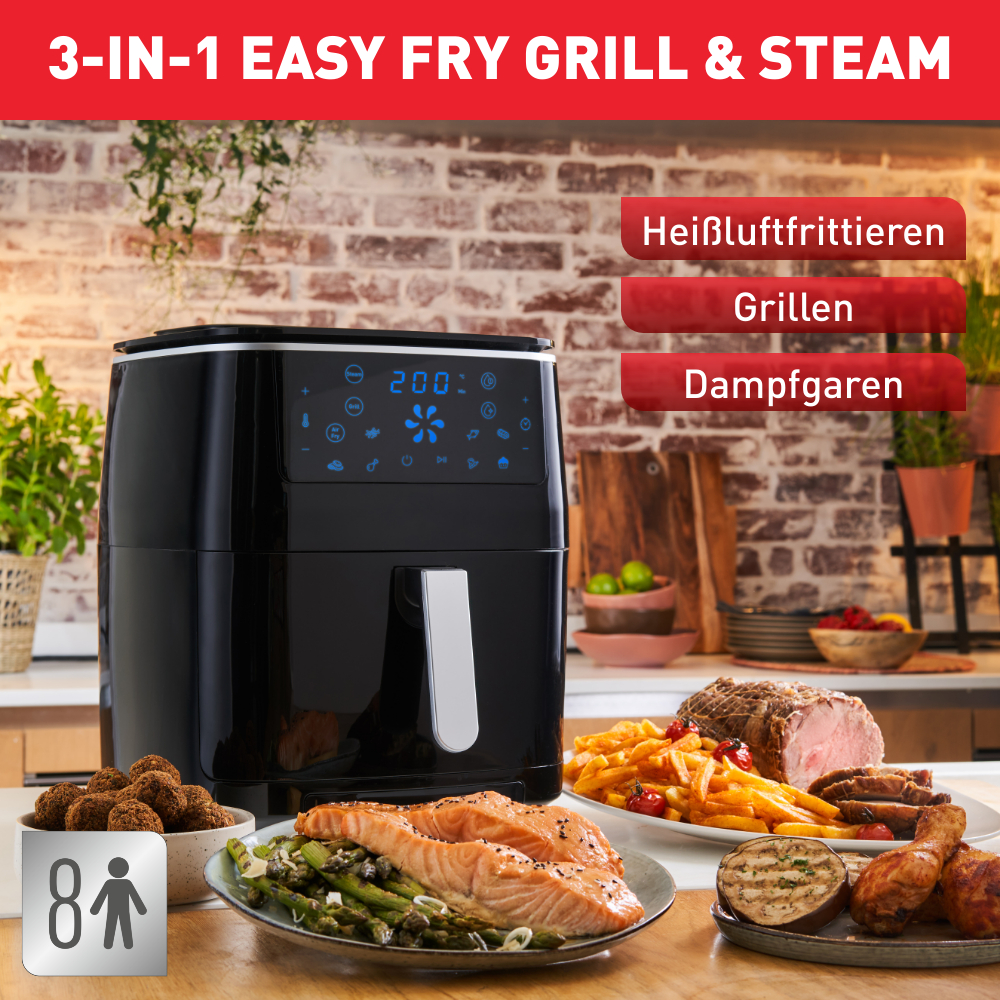 Schwarzer 3-in-1 Easy Fry Grill & Dampf, Essen auf Tellern, Holztisch.