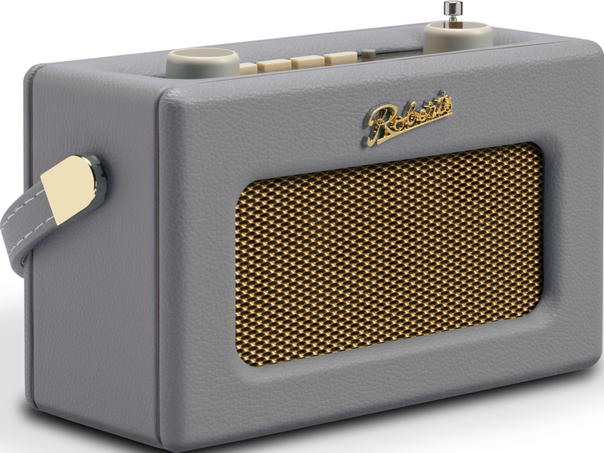 Ein grauer Retro-Radio mit goldenem Lautsprechergitter und Tragegriff.