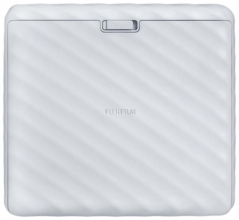 White Fujifilm Instax printer. Top view, with a slot. White background.