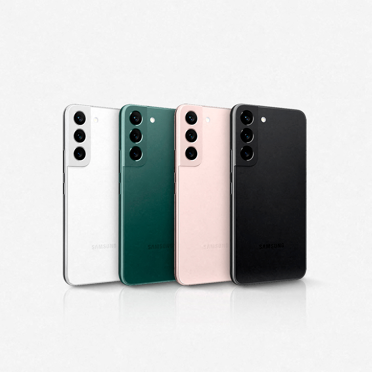 Cuatro teléfonos Samsung Galaxy S22 de colores, blanco, verde, rosa, negro, sobre fondo blanco.