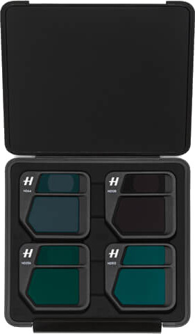 A black case containing four ND filters for a camera, arranged neatly inside.