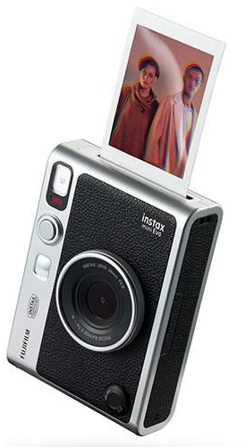 Silver and black Instax Mini Evo camera with a printed photo.