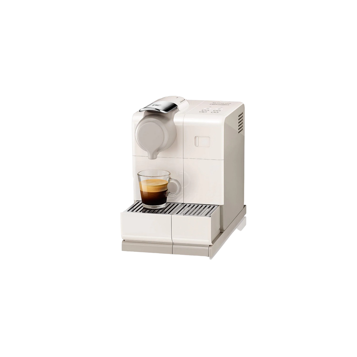 Una cafetera blanca con un vaso de café al lado.