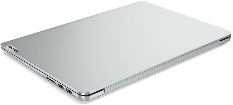 Ordinateur portable argenté fermé sur fond blanc. Le logo Lenovo est visible.