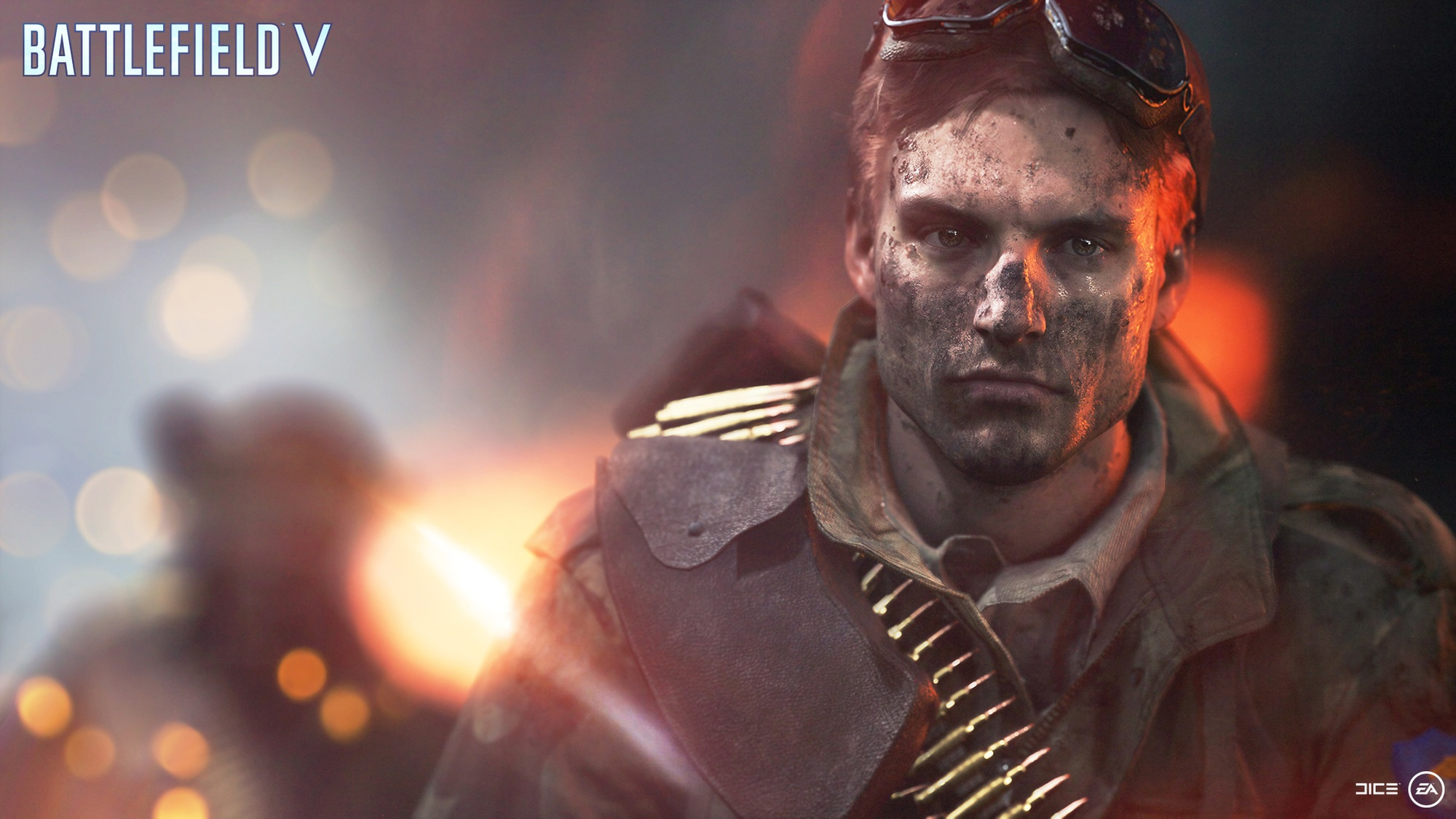 Scène du jeu Battlefield V : Un soldat avec de la saleté sur le visage, portant un casque. Le fond est flou.