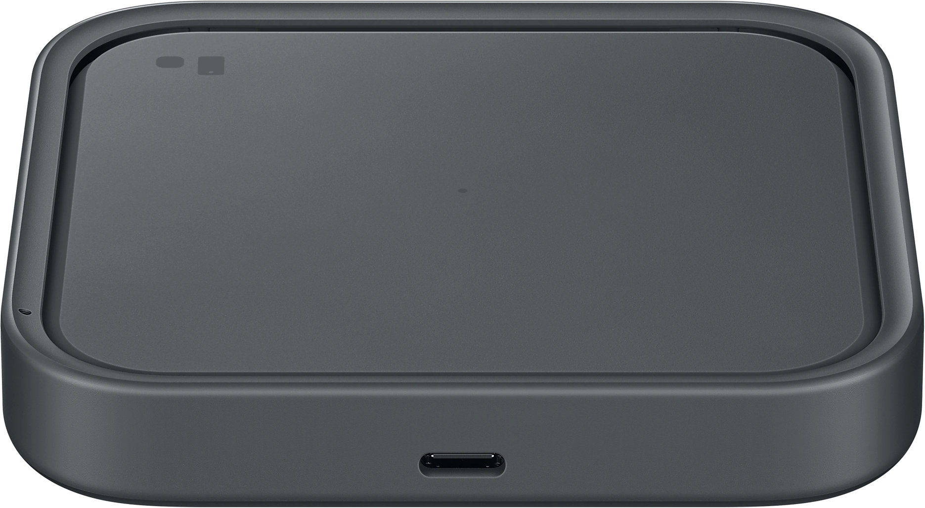 Sötétszürke vezeték nélküli töltő. USB-C port alul. Fehér háttéren.