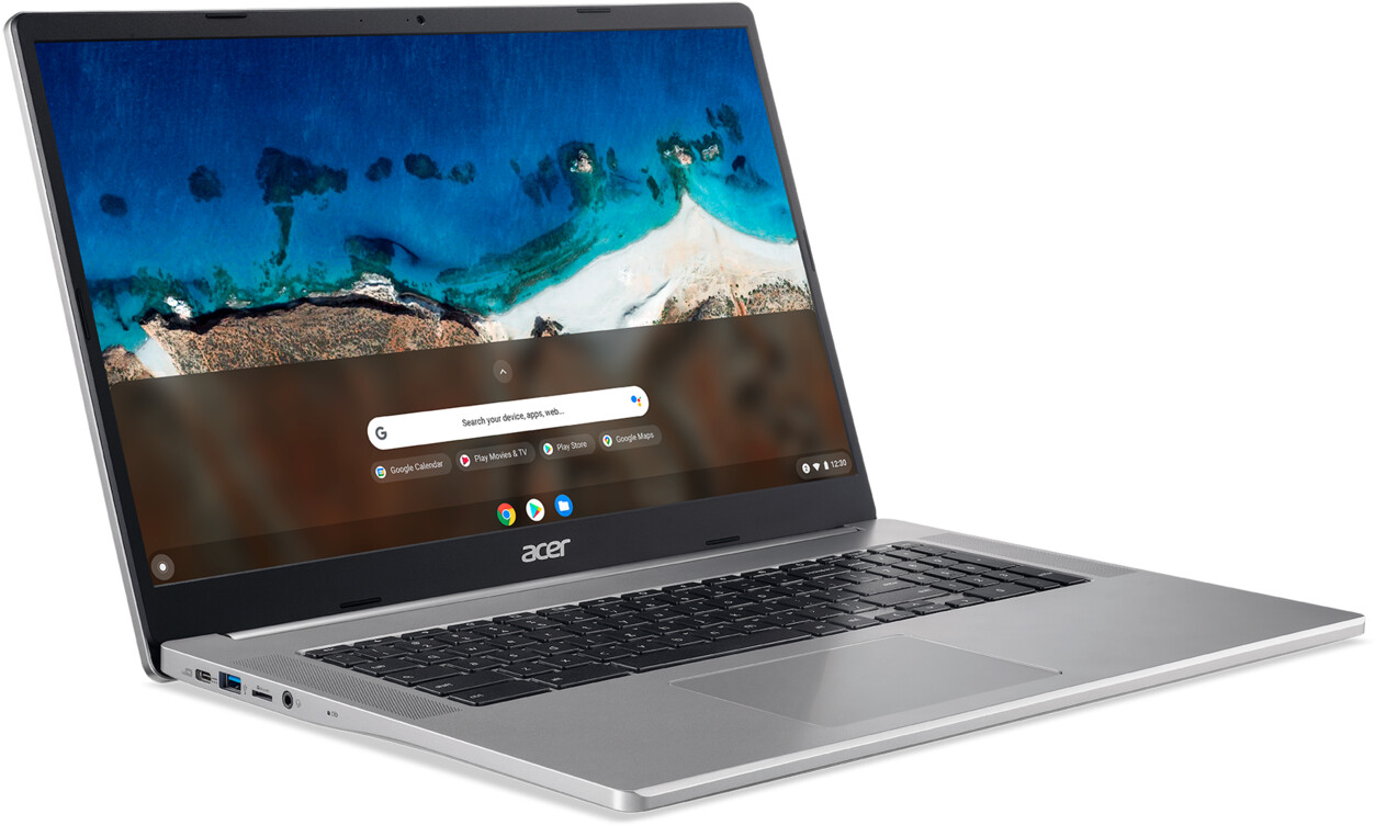 Ein silberner Acer-Laptop ist geöffnet. Der Bildschirm zeigt eine Strandszene. Die Tastatur ist schwarz, das Touchpad sichtbar.