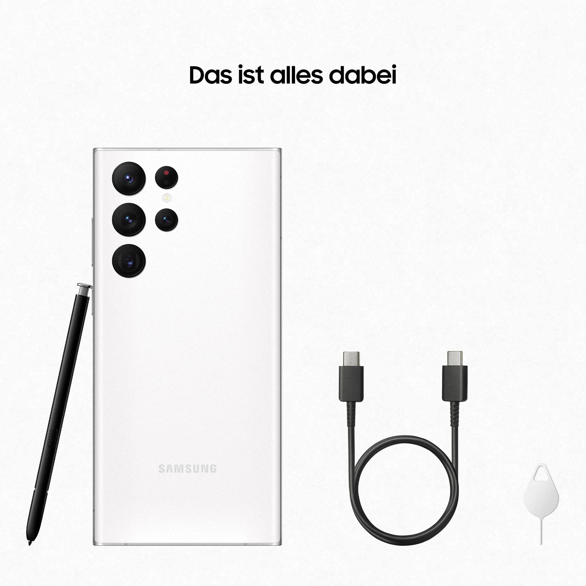 Ein weißes Samsung-Telefon mit Stift, zwei Kabeln und einem SIM-Tool, alles auf weißem Hintergrund.