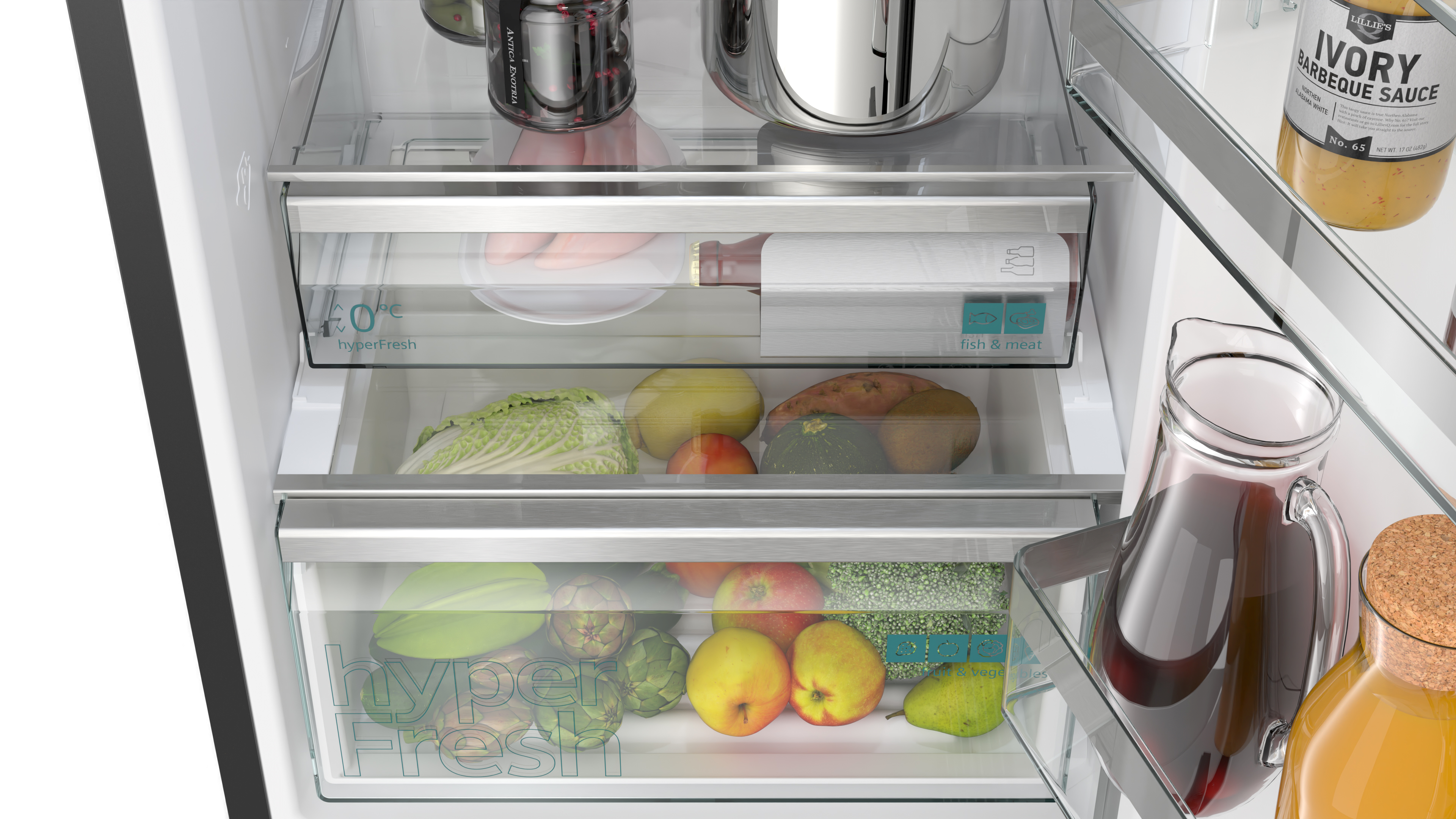 Im Inneren eines Kühlschranks mit Schubladen, die Obst, Gemüse und eine Weinflasche enthalten.