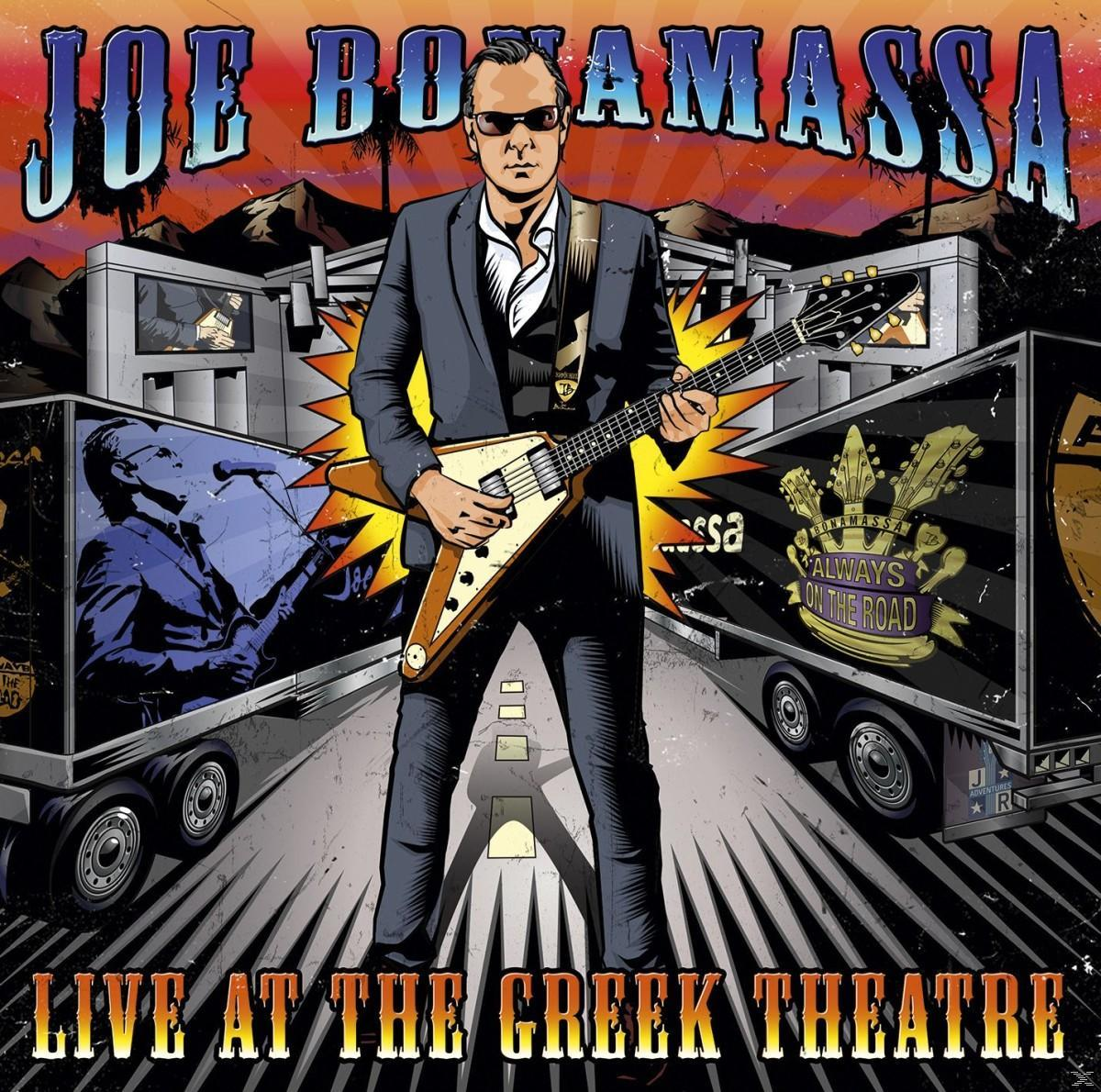 Joe Bonamassa album borítója egy férfivel, aki gitárt tart, és kamionokkal.