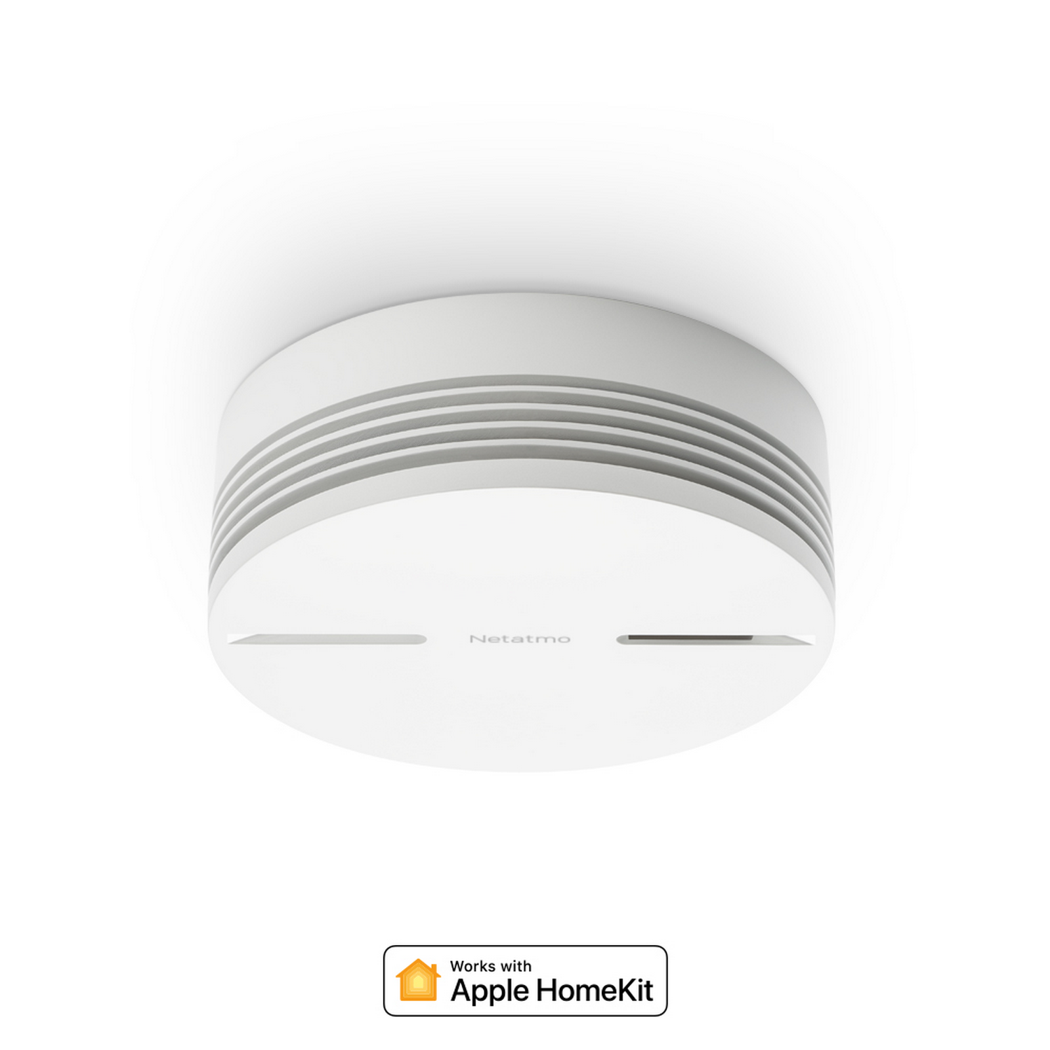 Detector de humo inteligente circular blanco sobre fondo blanco. Texto: Netatmo. Funciona con Apple HomeKit.