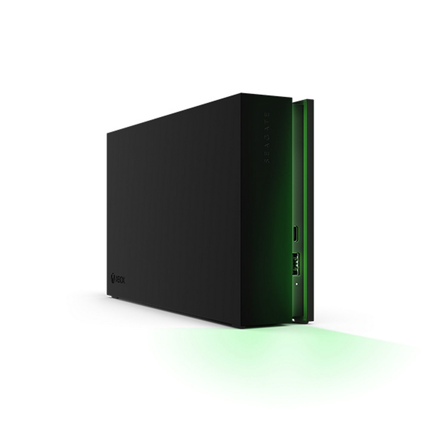 Disco duro externo Xbox negro. Luz verde lateral. Logo Xbox visible.