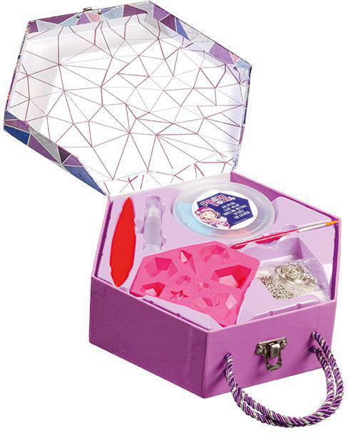 Eine rosa Bastelbox mit verschiedenen Werkzeugen, einschließlich eines roten Spatels und einem Deckel.