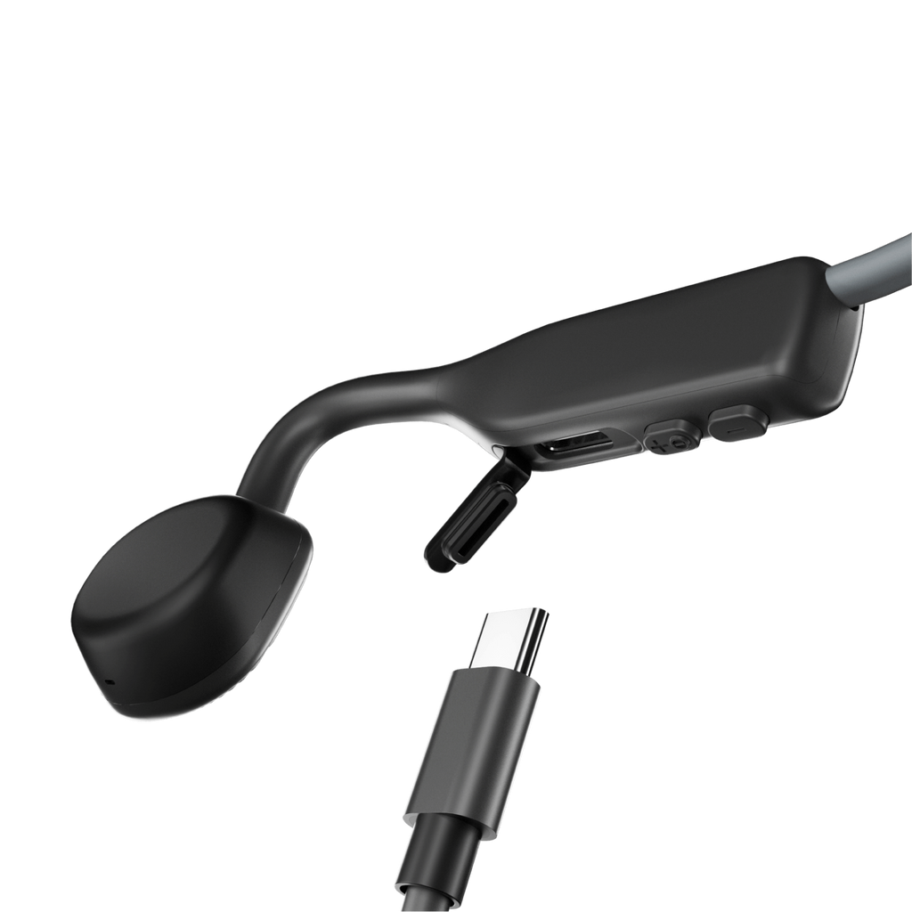 Schwarze Knochenleitungskopfhörer mit Ladeanschluss und Lautstärketasten, mit USB-C-Kabel.