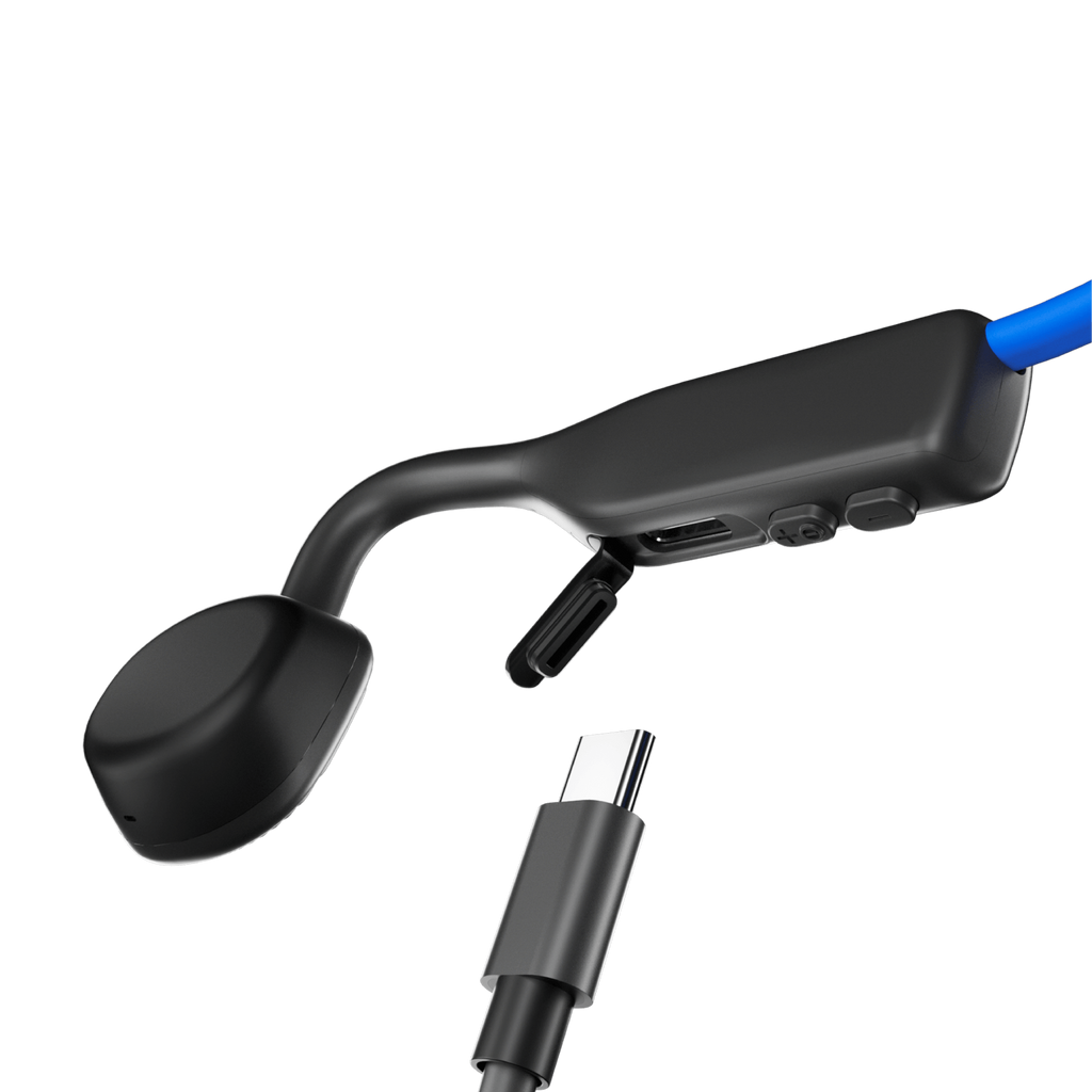 Schwarze Knochenschallkopfhörer mit USB-C-Kabelanschluss auf schwarzem Hintergrund.