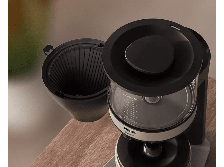 Coffee maker, open top, filter basket visible.