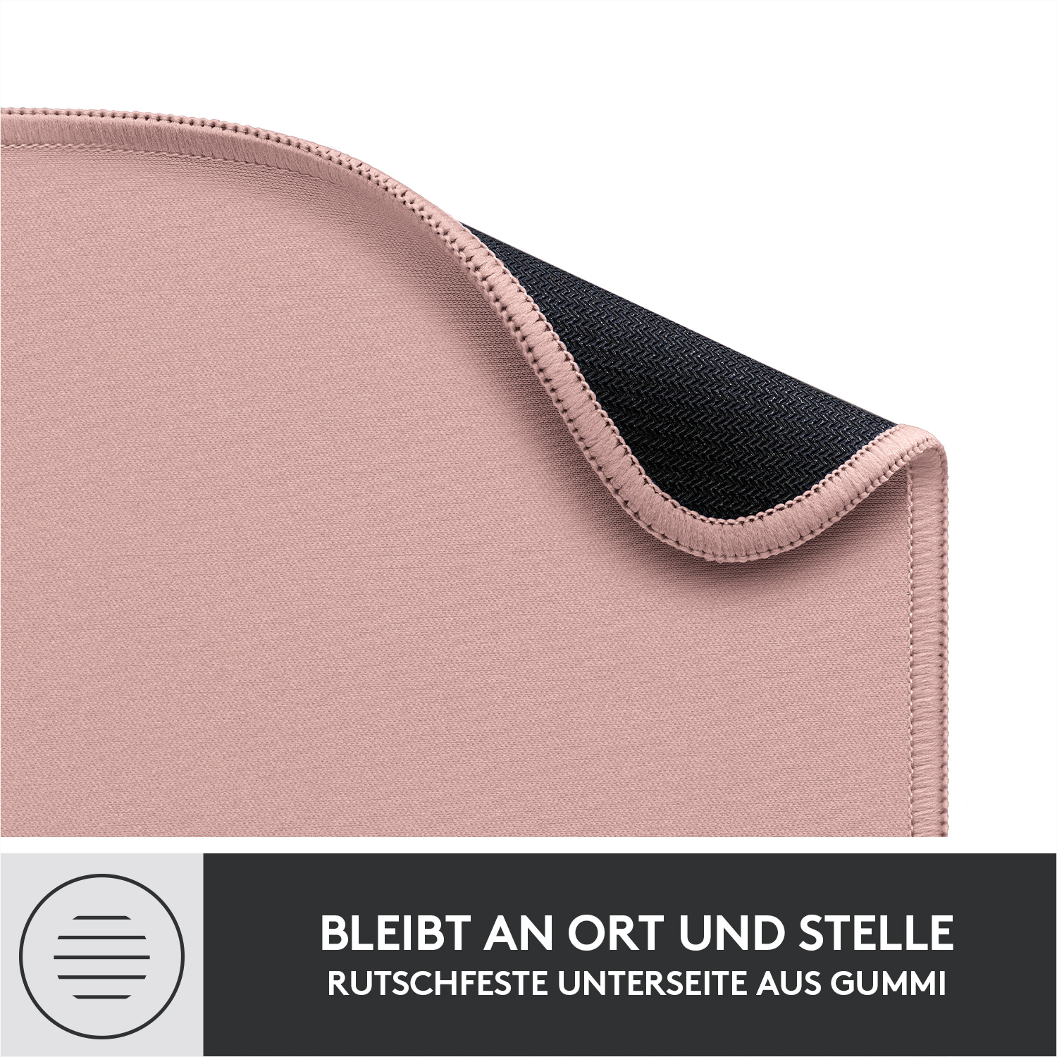 Rosa Mauspad mit schwarzer Gummiunterseite. Text: Bleibt an Ort und Stelle, Gummiunterseite.