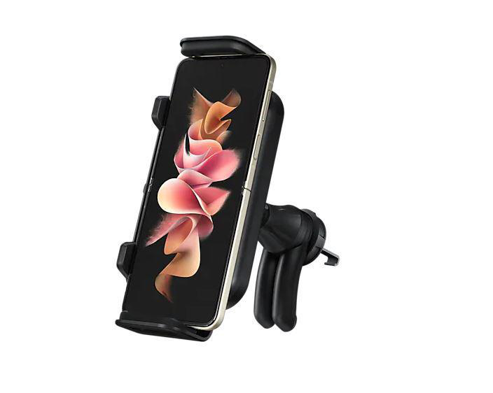 Schwarzes Telefon in einer Autotelefonhalterung. Der Bildschirm zeigt rosa Blumen.