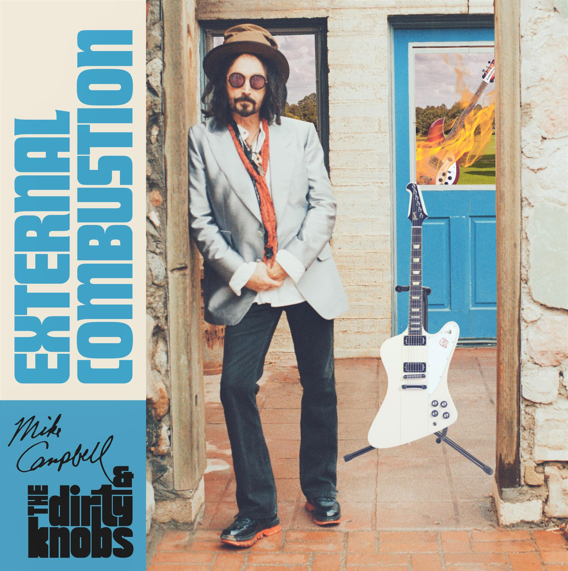Album borító: Férfi öltönyben, gitárral. Égő gitárok az ablakban. Szöveg: External Combustion, Mike Campbell.