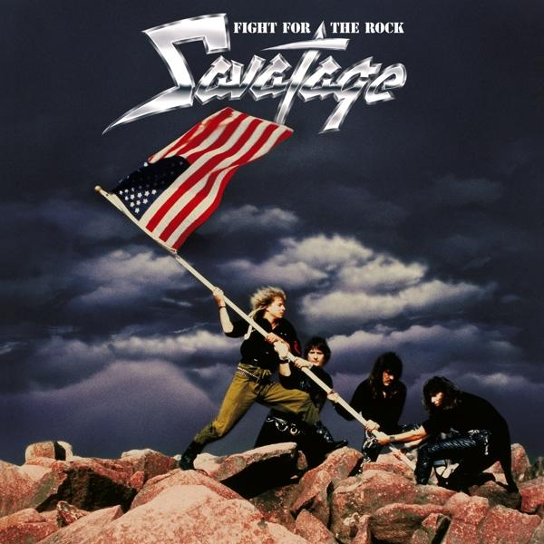 Album borító, a zenekar tagjai amerikai zászlót tartanak sziklás tájon.