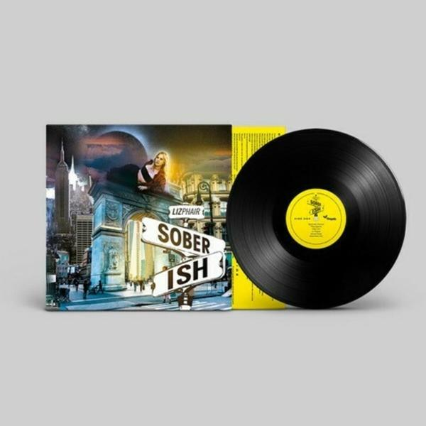 Vinil lemez és album borító, egy nőt és egy városi jelenetet ábrázol.