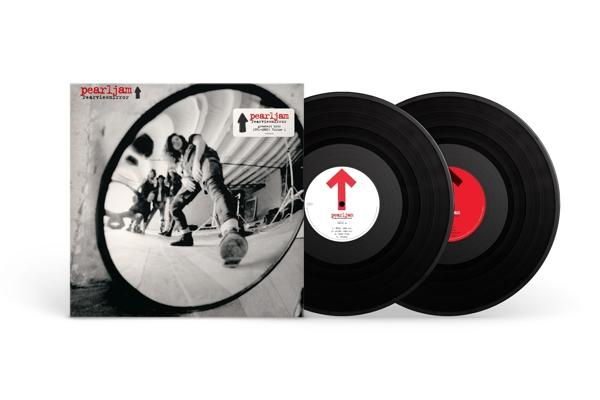 Pearl Jam album cover and two vinyl records. The cover shows a mirrored image of the band.