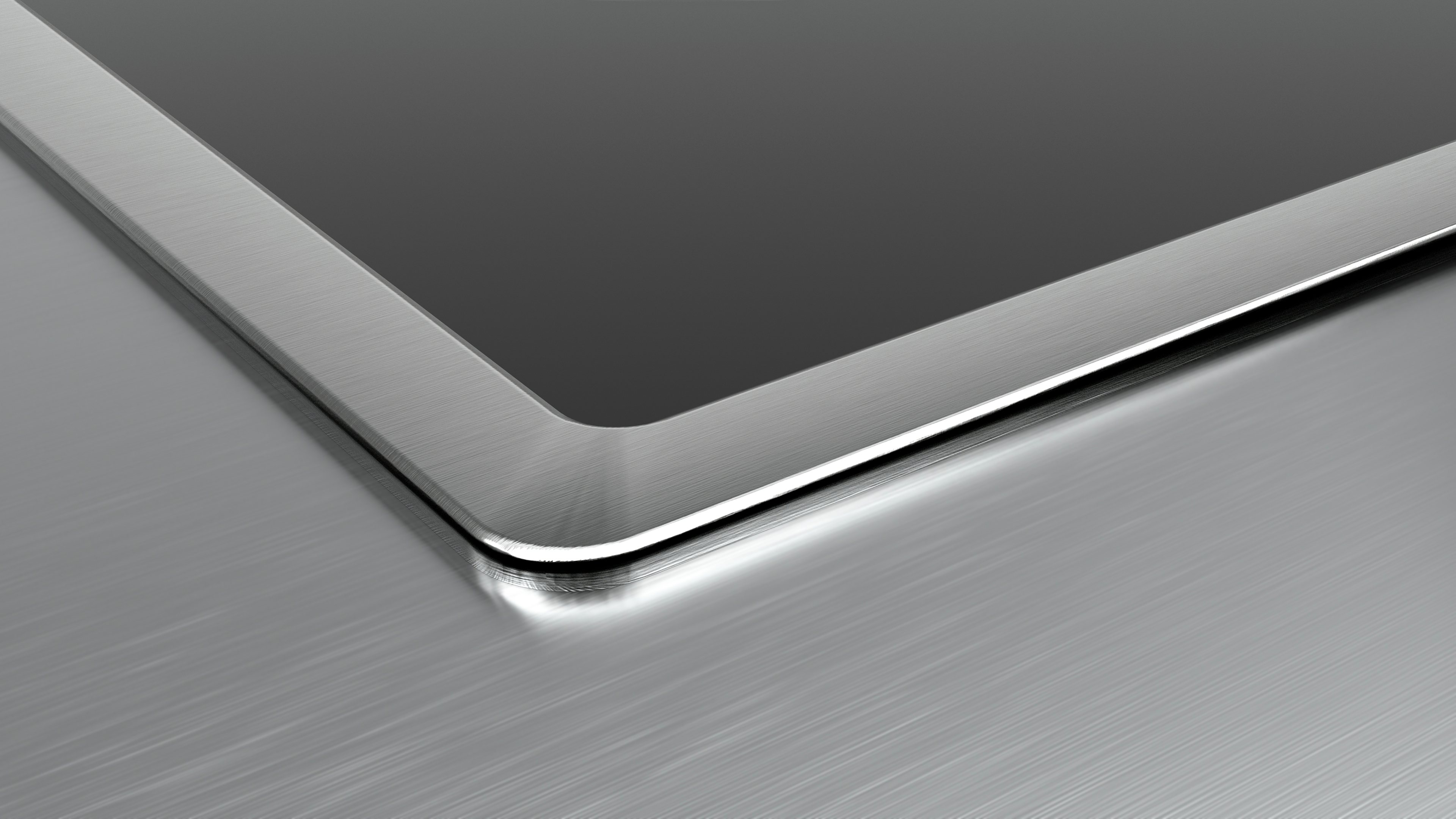 Nahaufnahme einer Tablet-Ecke mit metallischem, gebürstetem Finish.