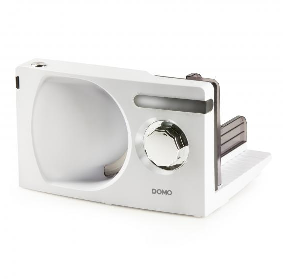 White and silver electric food slicer, angled, with a dial and the word 'DOMO'.