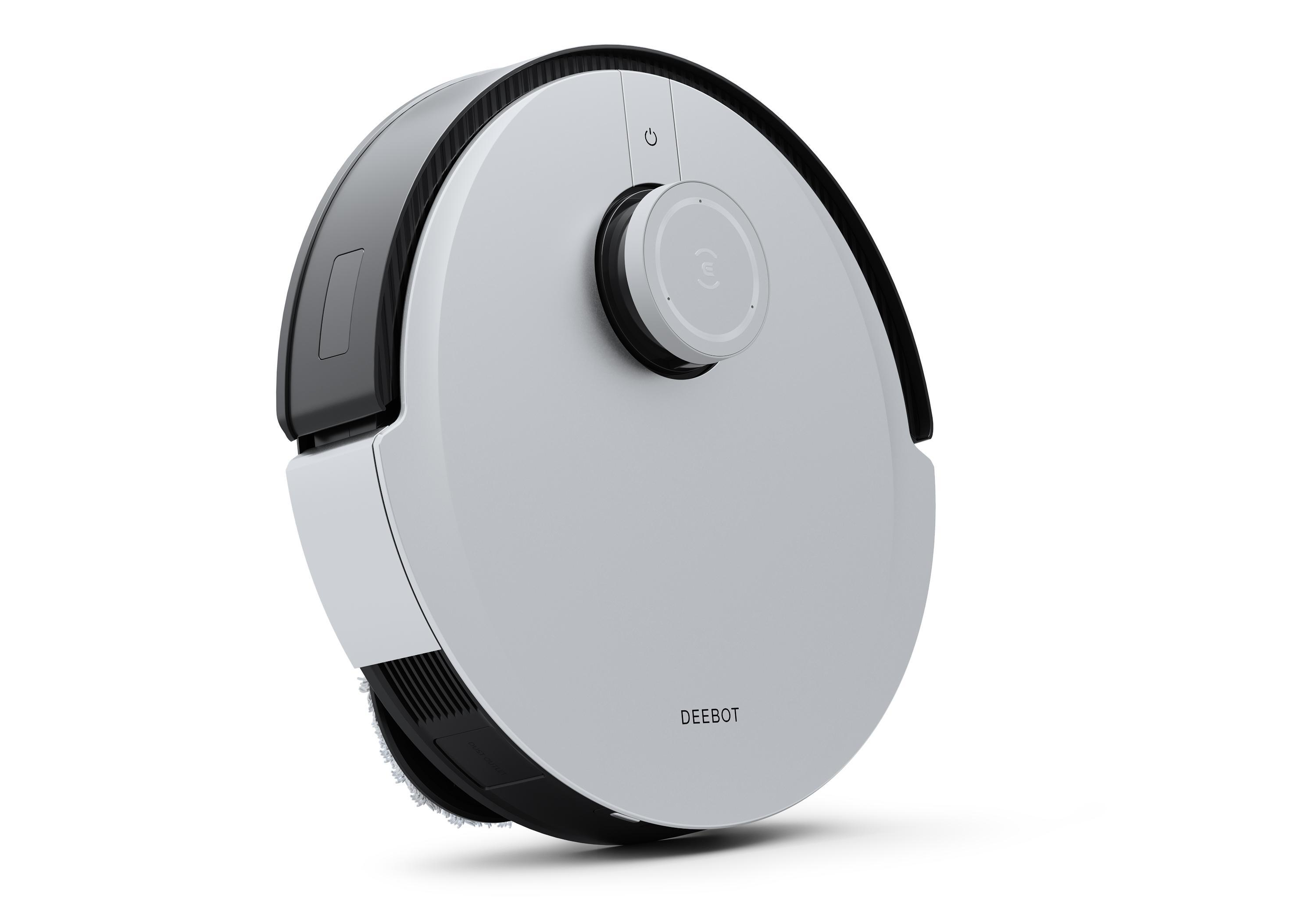 Ein weiß-schwarzer Roboter-Staubsauger. Die Oberseite hat einen Knopf und ein Rad.
